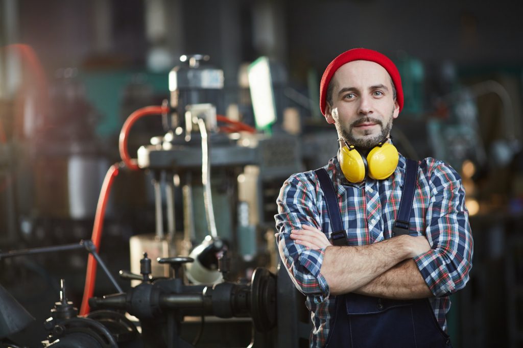 Worker Posing at Plant